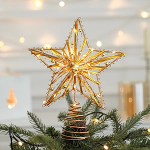 Golden Christmas tree topper star with warm LED lights and a spiral iron base