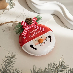 Christmas Santa metal bell ornament with pine needles and red striped bow decoration