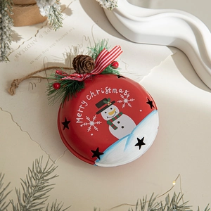 Festive red Christmas metal bell with snowman pattern, pine cones and rustic jute rope