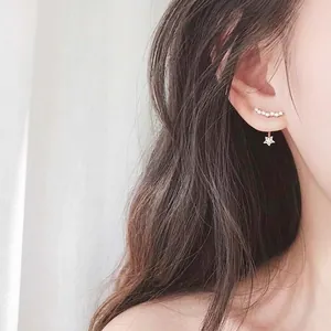 Elegant 925 silver star earrings with rows of sparkling zircon stones on female model