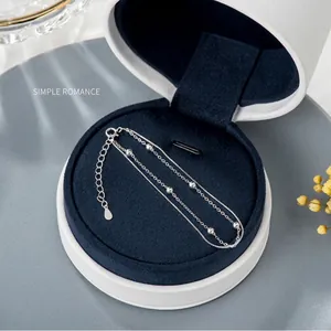 Close-up of S925 sterling silver double-layer bracelet in a blue jewelry gift box