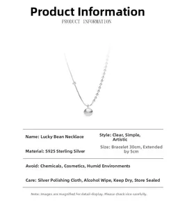 Detail of S925 sterling silver necklace with lucky bead pendant and dual-style chain