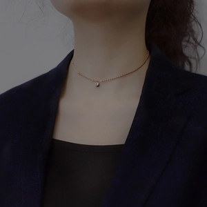 Elegant rose gold bead necklace with minimalist round pendant on neck for women