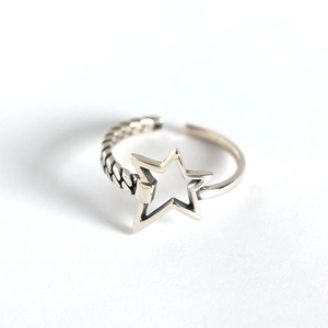 Silver adjustable star ring with unique braided texture and minimalist open design