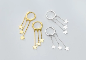 Detailed view of S925 sterling silver star fringe hoop earrings in gold and silver
