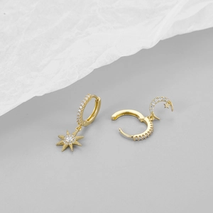 Star and moon asymmetric gold hoop earrings with sparkling cubic zirconia crystals