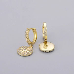 Detail of S925 silver stamp on gold plated star drop earrings with sparkling zircon