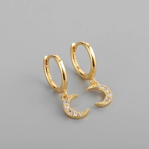 Macro shot of S925 hallmark on gold crescent moon earrings with cubic zirconia