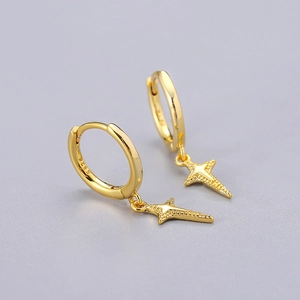 Detail shot of gold S925 sterling silver hoop earrings with textured star pendant