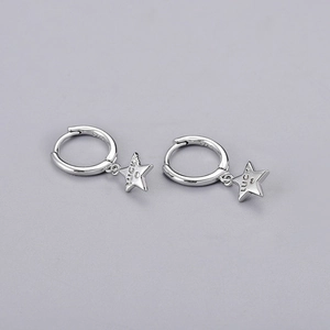 Macro view of S925 silver star earrings featuring Luck engraving and hallmark details