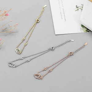 925 silver interlocking double ring bracelet with crystals in gold, silver and rose gold