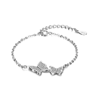 Silver-tone S925 double butterfly bracelet with pavé white zircon stones on white background