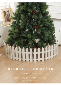 Detailed view of white plastic decorative fence pieces for Christmas tree base decoration