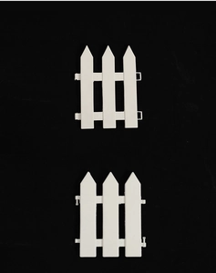 White plastic Christmas tree fence panels showing connection buckle details and slots