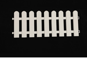 Detailed view of white plastic garden fence panels with interlocking clips for tree decor