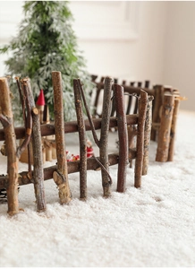 Macro detail of natural dark wood branch fence with rustic texture for Christmas decor