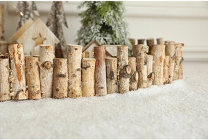 Detail of natural birch wood fence with white bark texture for Christmas scene decor