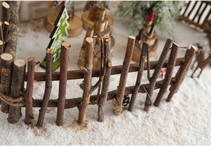 Macro detail of natural wood branch fence with hemp rope ties for Christmas scenes
