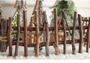 Macro view of natural wooden branch fence decoration with rustic bark texture