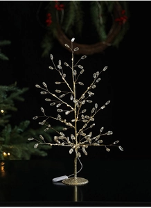 Detail of golden LED crystal tree light with faceted beads and a sparkling semi-sphere base