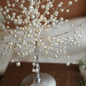 Elegant tabletop LED pearl tree with warm light and silver wire branches for decor
