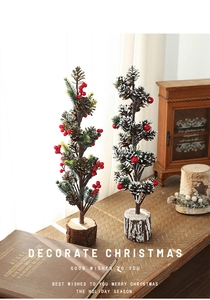 Close-up of pine cone Christmas trees with red berries on natural wooden bases