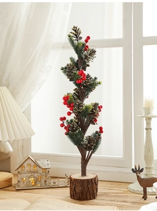 Close-up of 40cm mini Christmas tree with red berries, pine cones and wooden base