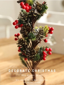 Detail of 40cm mini Christmas tree with red berries, pine cones and wooden base