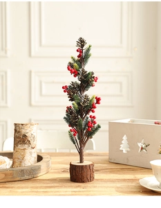 Detail of 40cm snowy Christmas tree with pine cones, red berries and wooden base