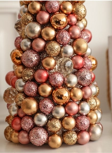 Detail of 35cm tabletop Christmas tree with rose gold ornaments in matte and glitter finishes