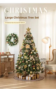 Close-up of a luxury Christmas tree with gold ornaments, bows, and festive gift boxes