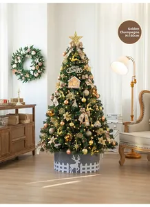 Detail of 180cm champagne gold luxury Christmas tree with glowing ornaments in a cozy room