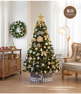 Close-up of 180cm luxury Christmas tree with gold and white baubles and ribbons