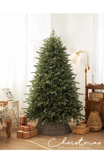 Detailed view of luxury pre-lit Christmas tree with warm LED lights and a stylish base