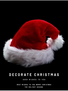 Close-up of plush red Christmas hat with soft white faux fur trim and fluffy pom-pom detail