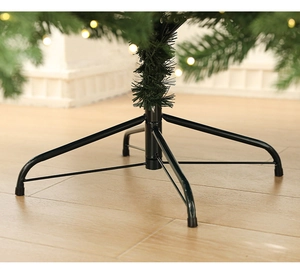 Detail of Christmas tree metal stand with anti-slip rubber pads and warm LED lights