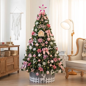 Luxurious artificial pink and white Christmas tree with lights and premium ornaments