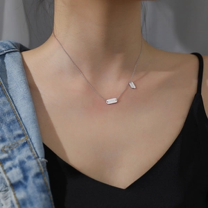 925 silver Lucky letter necklace with double rectangular pendants on a female model