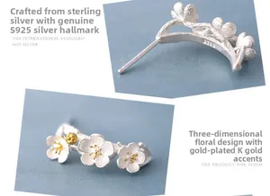 Macro detail of S925 sterling silver cherry blossom studs with gold plated floral centers