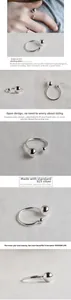 Detail of S925 sterling silver open ring featuring minimalist 8mm and 4mm double ball design