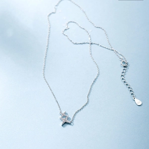 Detailed macro view of S925 silver necklace with double star pendant and zircon inlays