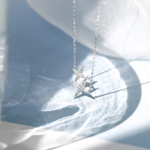 Minimalist double star pendant necklace with cubic zirconia pavé in silver tone