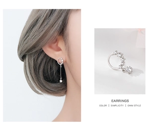 Detail view of S925 silver earrings with sparkling zircon crystals on long chain