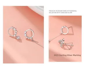 Macro view of S925 sterling silver geometric hoop earrings showing hallmark detail