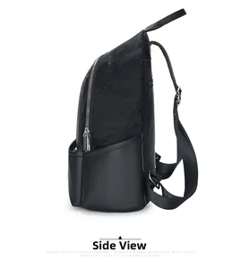 Side view of black backpack featuring pleated fabric and smooth leather texture details