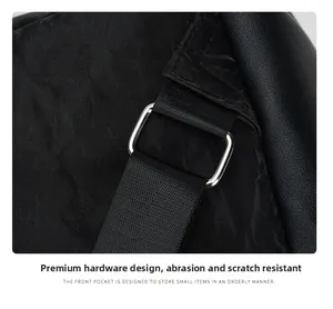 Detailed macro view of durable silver D-ring hardware and woven strap on black backpack