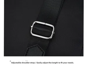 Close-up of adjustable shoulder strap with silver metal buckle and lychee grain leather detail