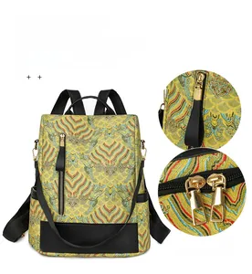 Detail of Chinese brocade backpack with golden wave pattern and premium metal zippers