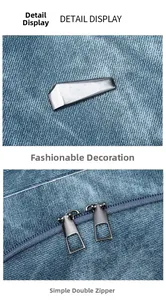 Details des blauen Denim-Rucksacks mit Silberschmuck und glattem Doppelreißverschluss