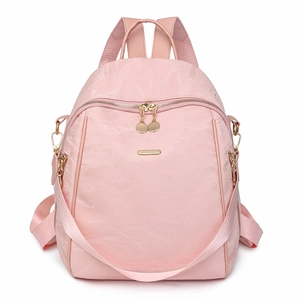 Pink oxford fabric backpack for women with gold hardware and versatile wide shoulder strap